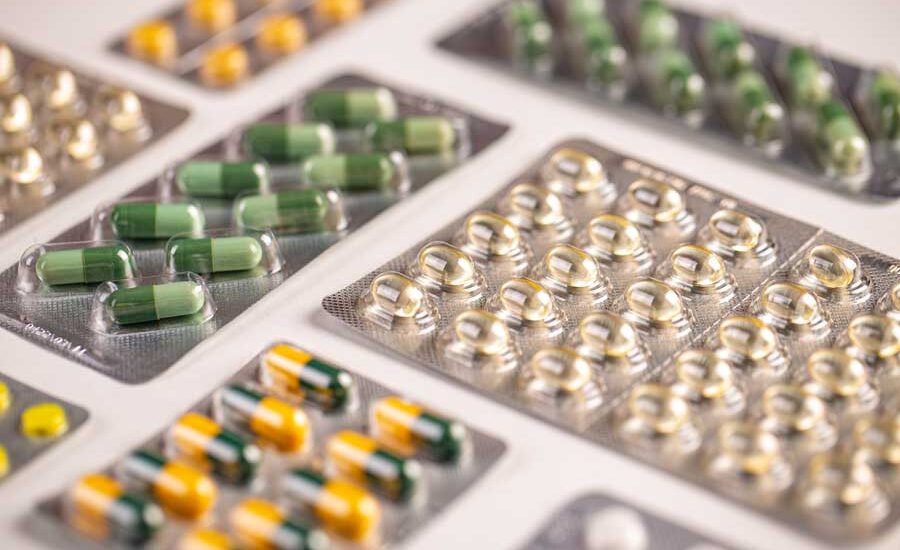 Different colored pills in different packaging