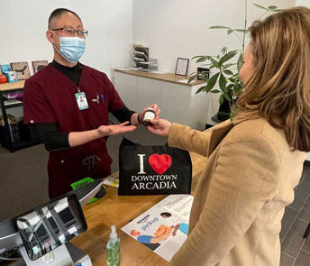 Dr. John Kong from Pacific Oak Compounding Pharmacy helping a customer